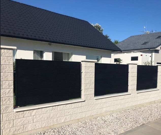 Solar panel fence in front of the house